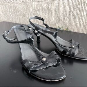 Stuart Weitzman Black Patent T-Strap Heels with Logo Studs
